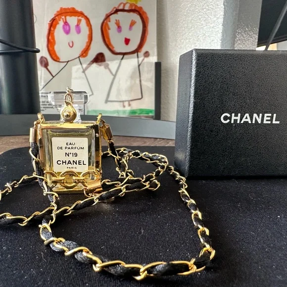 CHANEL | Accessories | Chanel Gold And Black Chain Perfume  display picture 1